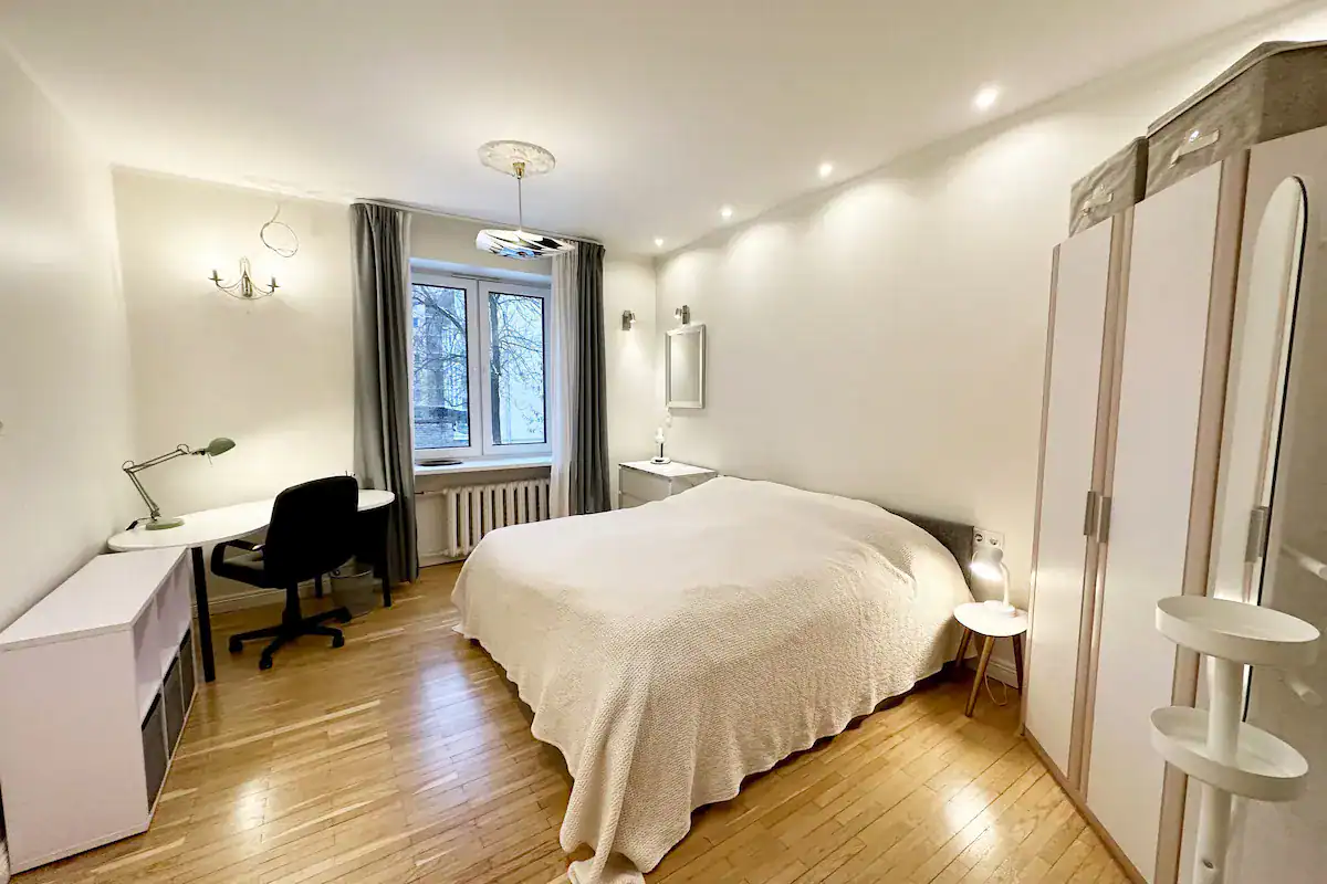 Bright, welcoming hotel room in Estonia with comfortable bed and workspace.