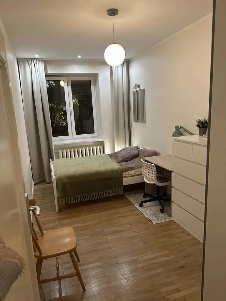 Bright city centre accommodation in Tallinn with comfortable bed and work desk.