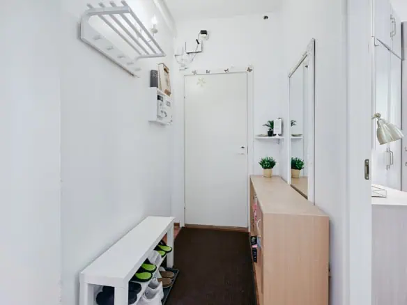 Bright and welcoming hostel entrance at Koolrooms Tallinn with modern décor and clear signage.