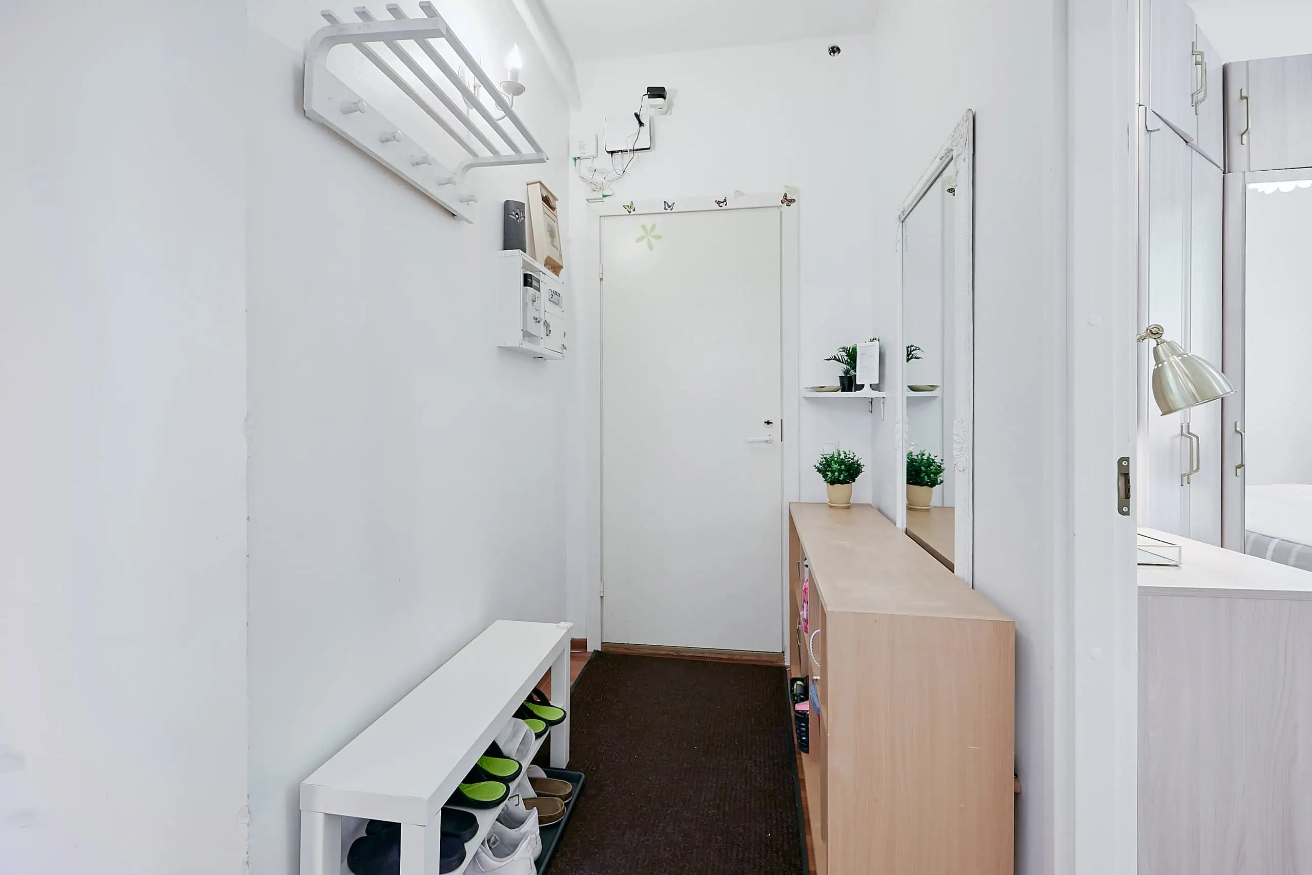 Bright and welcoming hostel entrance at Koolrooms Tallinn with modern décor and clear signage.