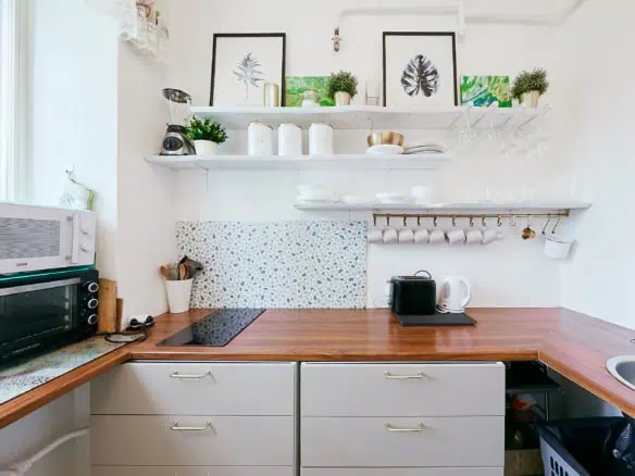 A clean, modern kitchen in Tallinn with essential appliances and decorative touches for a comfortable stay.