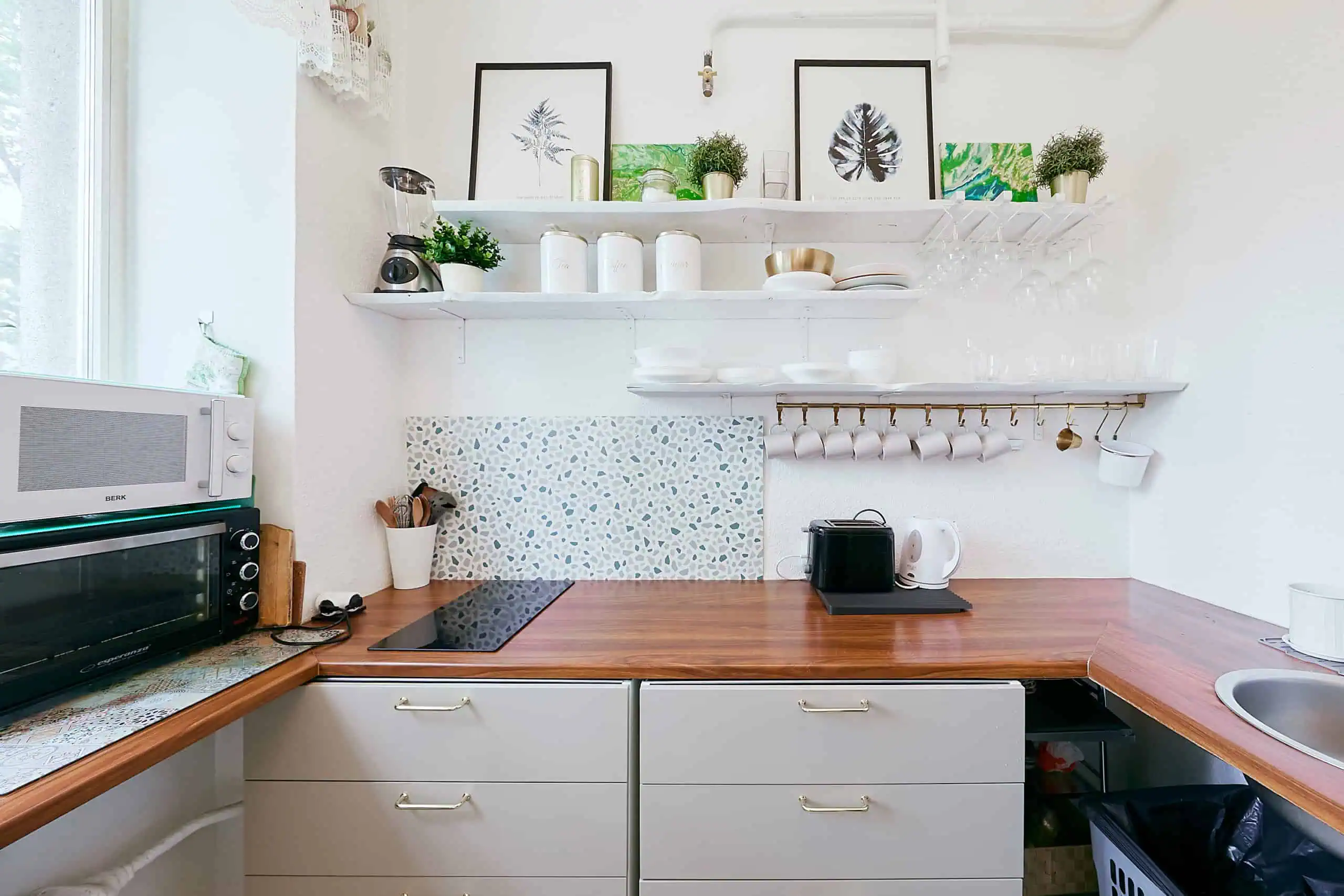 A clean, modern kitchen in Tallinn with essential appliances and decorative touches for a comfortable stay.