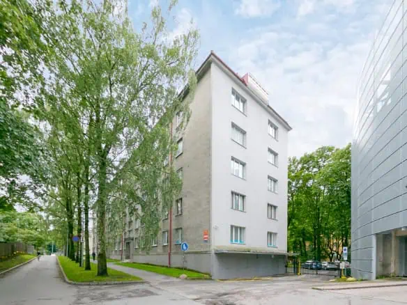 Spacious city hotel in Tallinn by lush greenery, ideal for comfort and convenience.