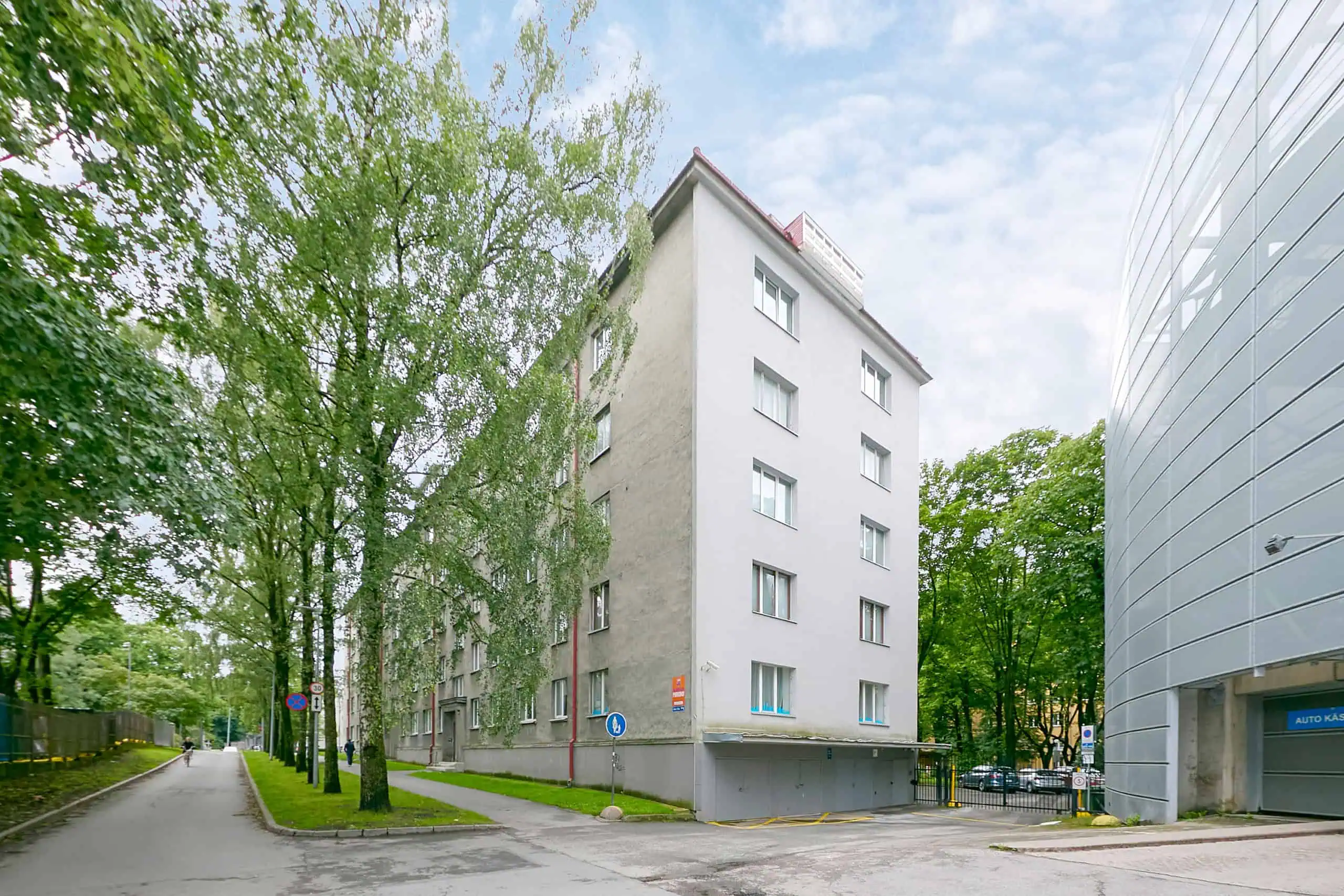 Spacious city hotel in Tallinn by lush greenery, ideal for comfort and convenience.