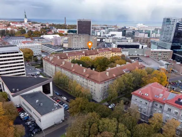 Aerial view of Tallinn city centre featuring historic buildings and modern skyscrapers.
