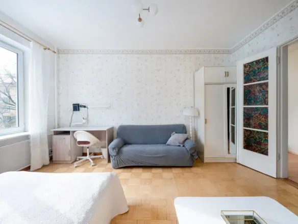 Cozy Tallinn apartment room at Koolrooms Tallinn with modern furnishings and large window view.