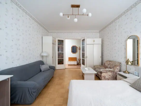 Cozy Tallinn apartment living room with vintage decor and modern furnishings.