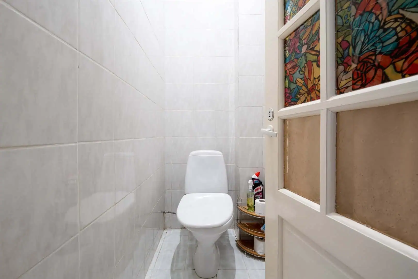 Cozy private toilet room in Koolrooms Tallinn hostel, simple clean design.