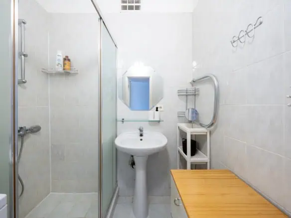 Cozy Tallinn hostel bathroom with shower, sink, and modern amenities at Koolrooms Tallinn.