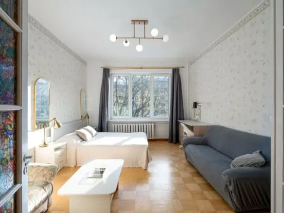 Bright room with large window, stylish furniture, and relaxing atmosphere in Tallinn.
