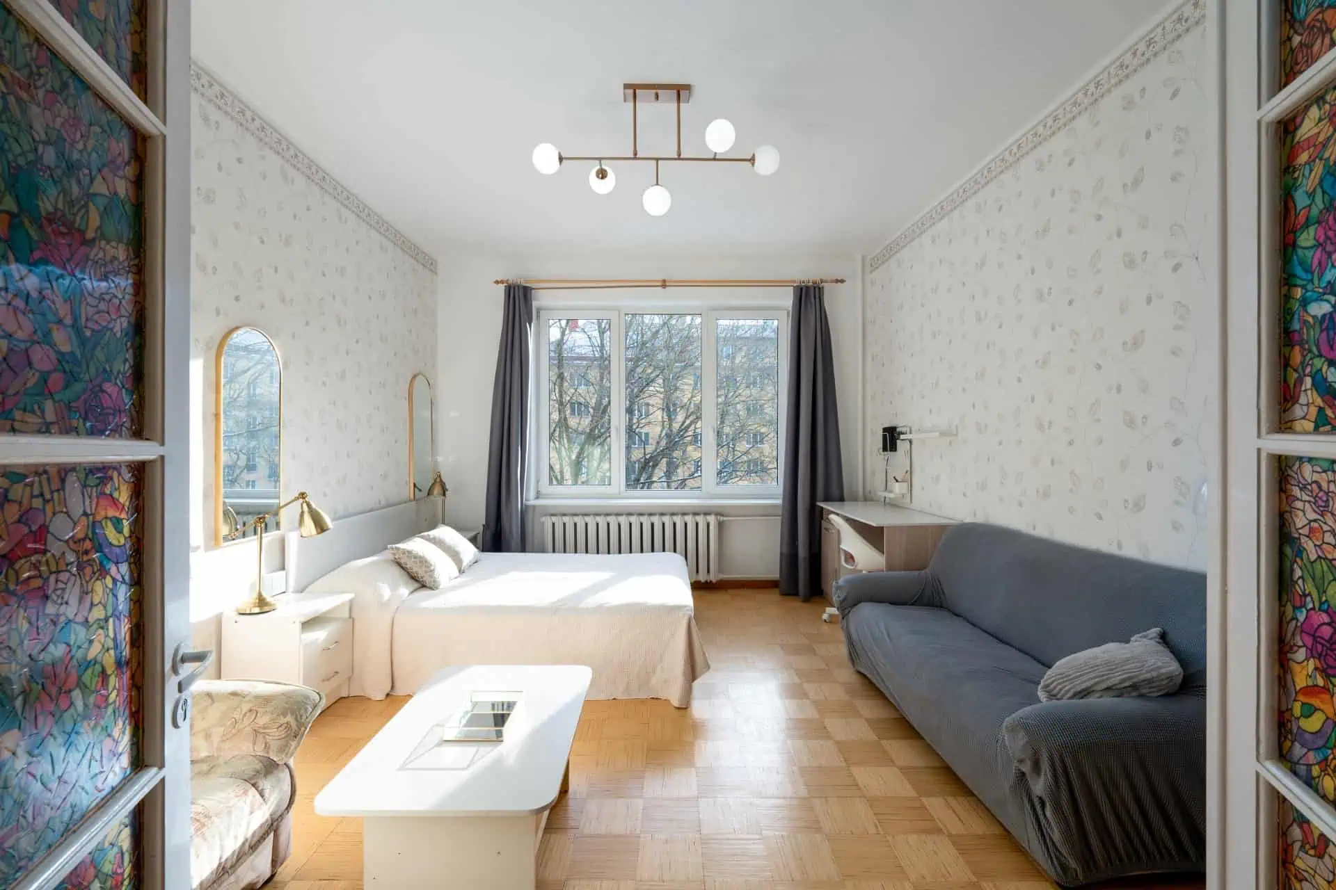 Bright room with large window, stylish furniture, and relaxing atmosphere in Tallinn.