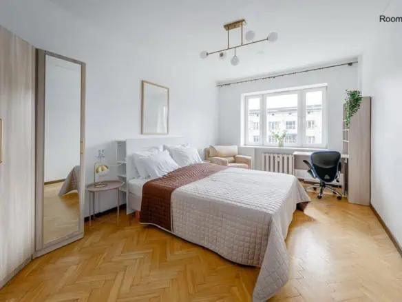 Bright, clean Tallinn accommodation with a comfortable bed, workspace, and natural light. (This room has light-blocking curtains which were unfortunately in dry cleaning day of photography)