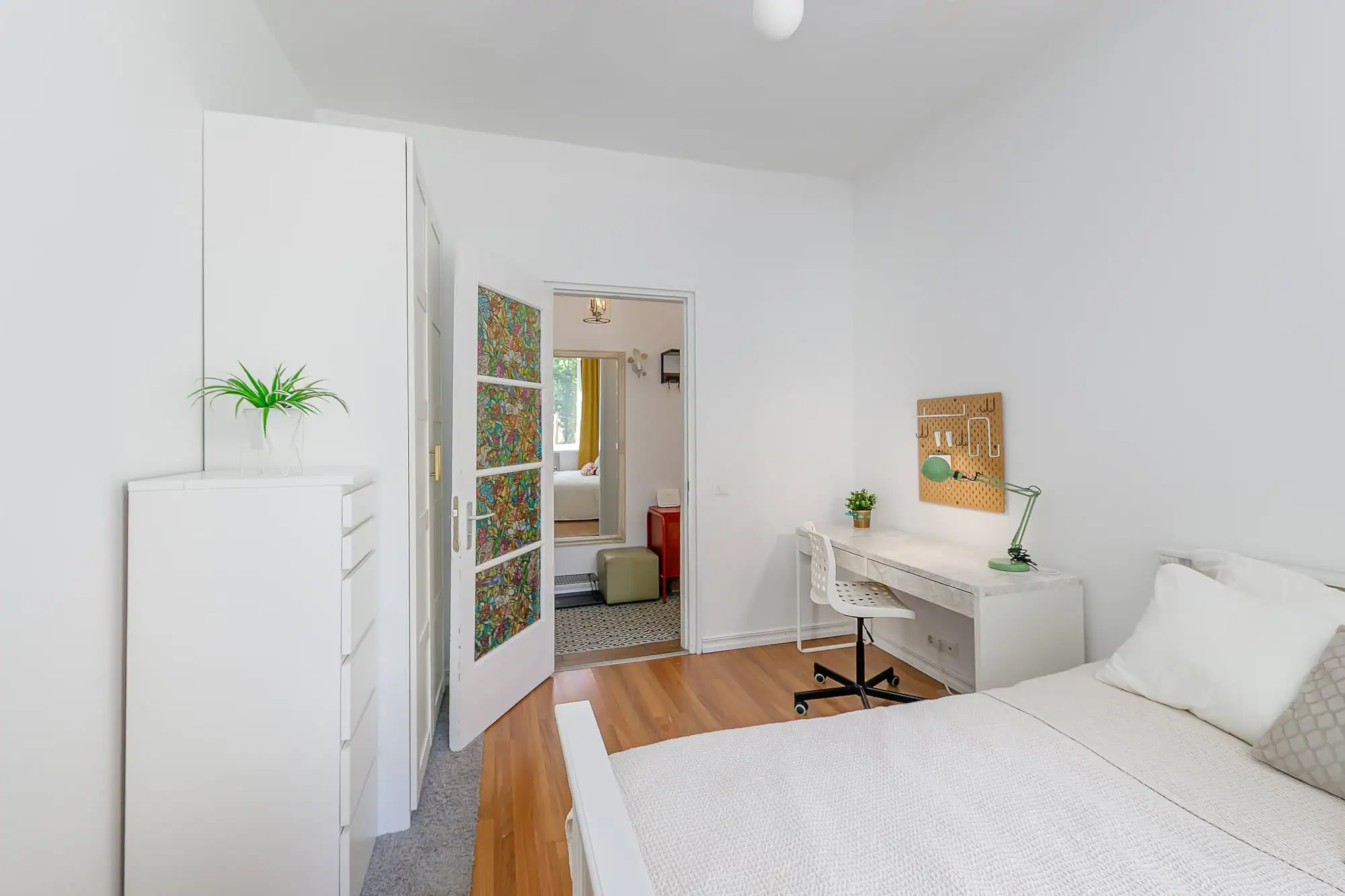 Bright studio apartment in Tallinn with contemporary decor and functional workspace.