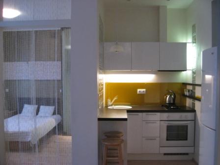 Modern kitchenette in Koolrooms Tallinn student apartment with compact appliances and stylish decor. Cozy interior of Koolrooms Tallinn student apartment featuring a welcoming kitchenette with essential amenities and contemporary design.